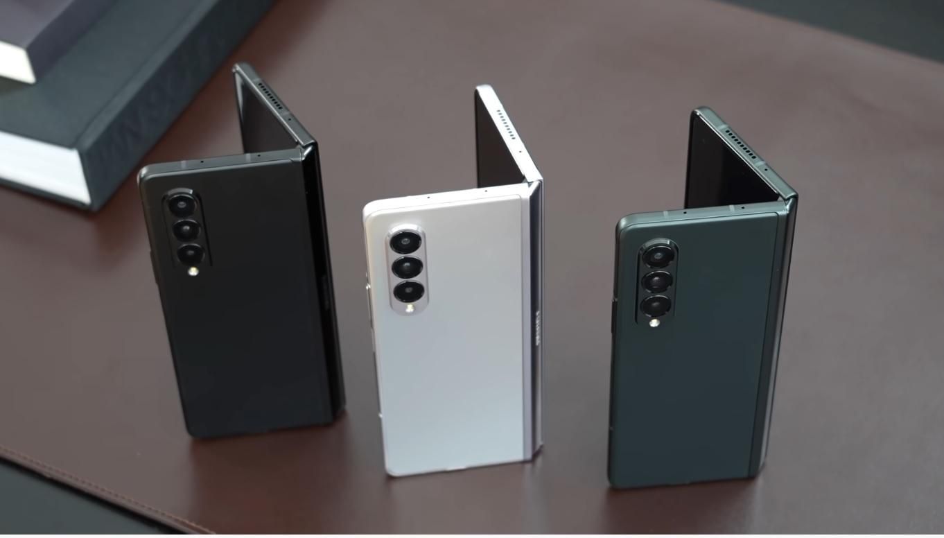 Three Samsung Galaxy Z Fold 3 models on desk